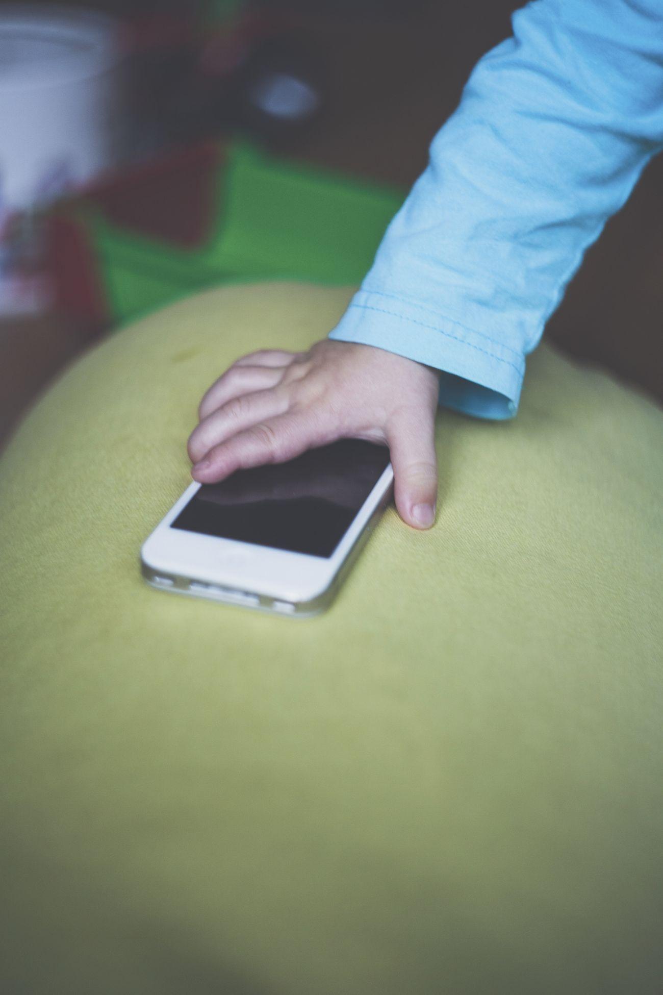 Little boy picking up a phone