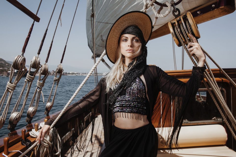 stylish woman standing on deck