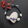 Evil Eye Anklet with Black Beads and Kaudi Shells